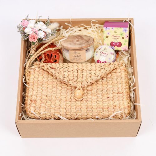 care gift box for women comes with woven bag, organic lip balm and scented candle in eco wrapping box